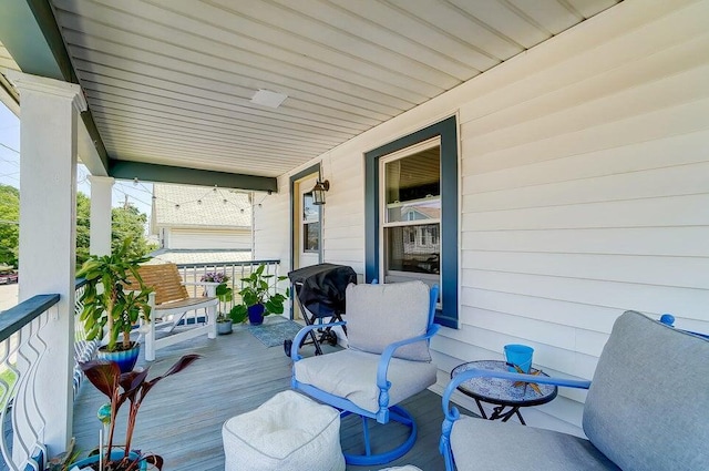 wooden deck featuring covered porch