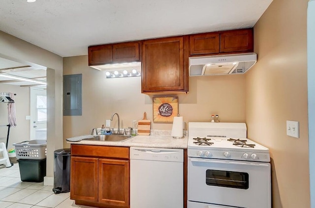 kitchen with sink, light tile patterned floors, electric panel, and white appliances