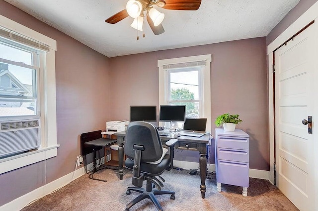 home office featuring cooling unit, ceiling fan, carpet floors, and a textured ceiling