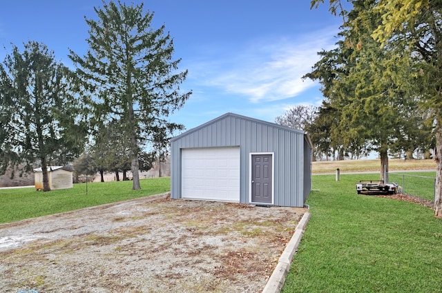 detached garage featuring driveway