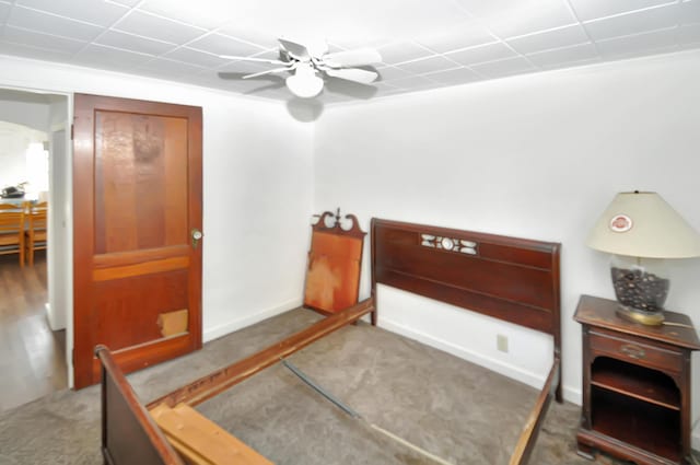 bedroom featuring a ceiling fan and baseboards