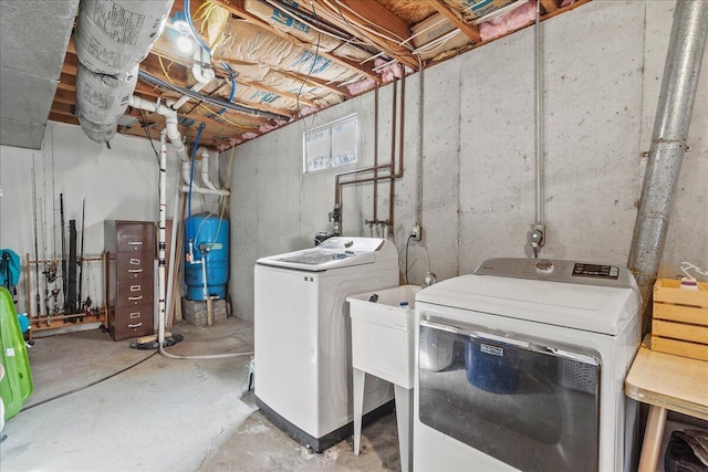 washroom featuring laundry area and washer and clothes dryer