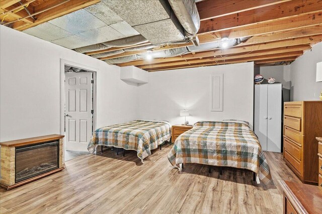 bedroom with wood finished floors