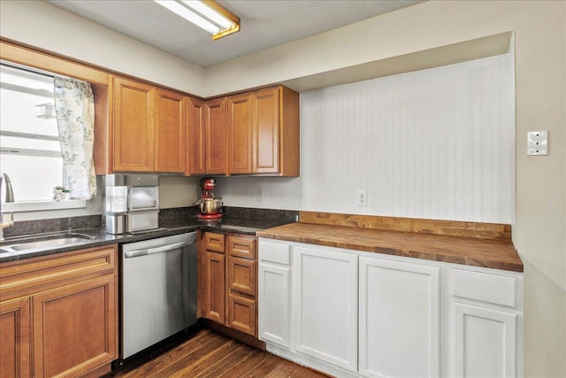 kitchen with a sink, dark wood-type flooring, dishwasher, and brown cabinetry