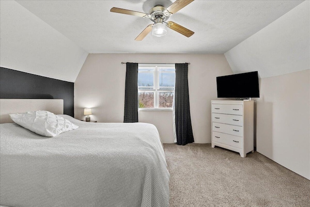 bedroom with light carpet, ceiling fan, and lofted ceiling