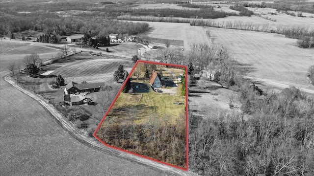 birds eye view of property with a rural view