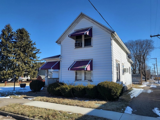 view of side of home featuring cooling unit