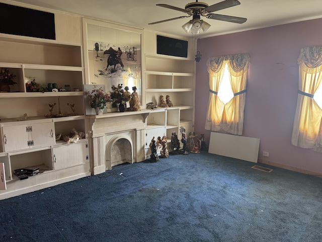 925 Sherman Ave, Springfield, OH 45503 - unfurnished living room with a ceiling fan, carpet floors, crown molding, and visible vents