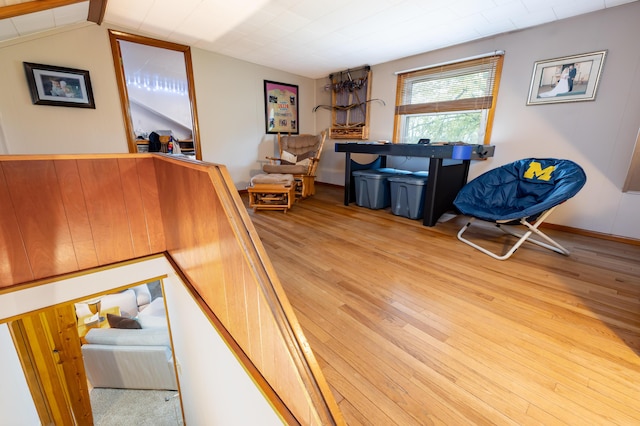 interior space with beamed ceiling and light wood-style floors
