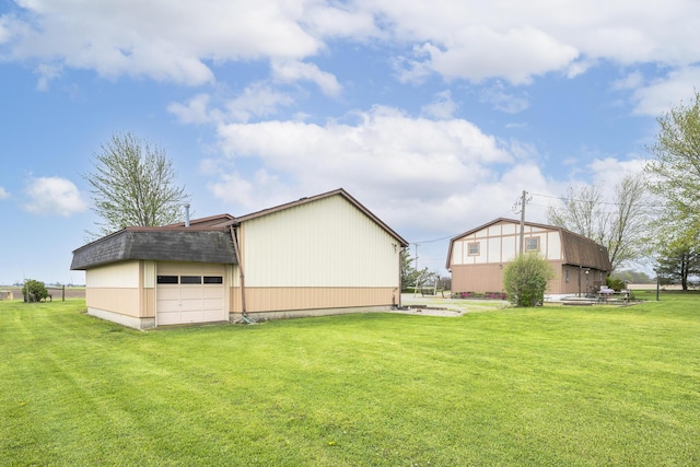 exterior space featuring an outbuilding and a detached garage