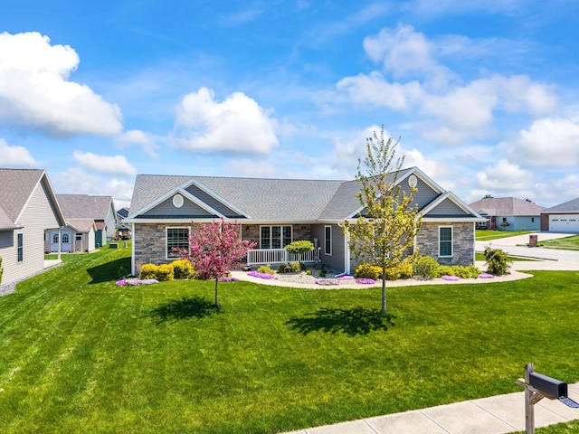 view of front of property featuring a front lawn and stone siding