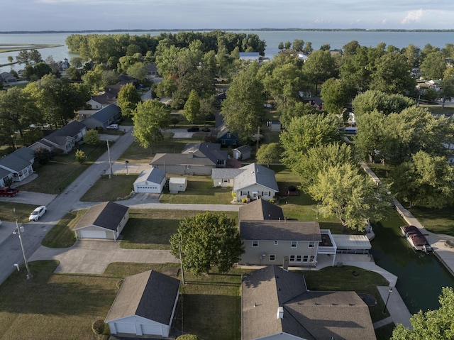 drone / aerial view featuring a residential view and a water view