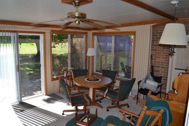 dining room featuring carpet floors and a ceiling fan