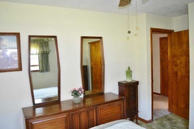 carpeted bedroom featuring baseboards