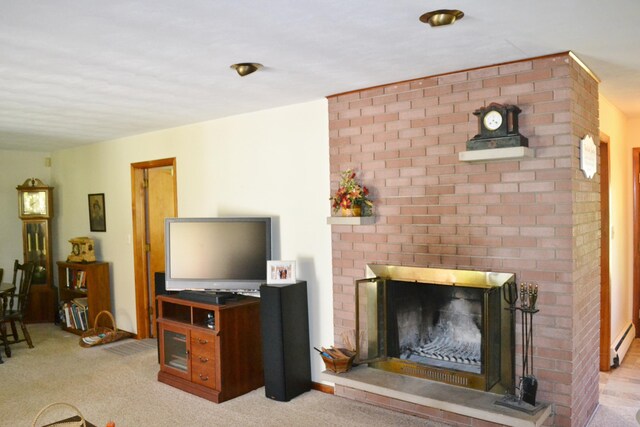 carpeted living room featuring a fireplace and a baseboard radiator