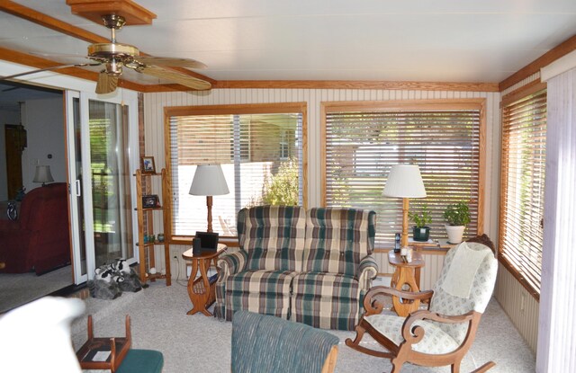 interior space with ceiling fan and carpet flooring