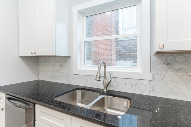 404 N Main St, Jackson Center, OH 45334 - kitchen with a sink, white cabinets, dark stone counters, backsplash, and plenty of natural light