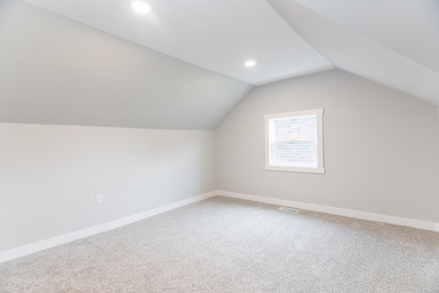 404 N Main St, Jackson Center, OH 45334 - additional living space with carpet floors, vaulted ceiling, baseboards, and recessed lighting