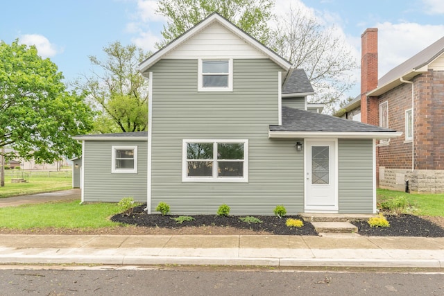 404 N Main St, Jackson Center, OH 45334 - traditional-style home featuring roof with shingles
