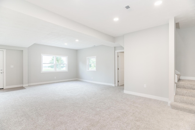 404 N Main St, Jackson Center, OH 45334 - spare room with light colored carpet, recessed lighting, baseboards, and stairs