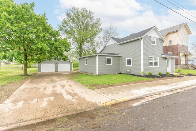 404 N Main St, Jackson Center, OH 45334 - view of property exterior with an outdoor structure, a yard, and a detached garage