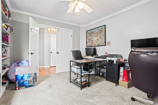 carpeted home office with ornamental molding, baseboards, and ceiling fan with notable chandelier
