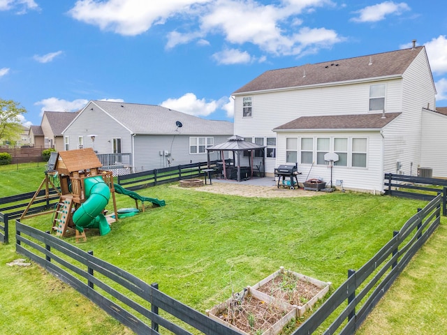 back of house with a patio, a playground, a gazebo, a lawn, and a fenced backyard