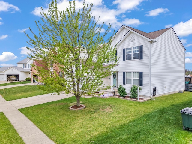 view of front of house featuring a front lawn and driveway