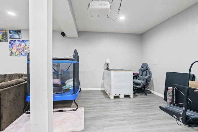 office featuring baseboards, recessed lighting, and wood finished floors
