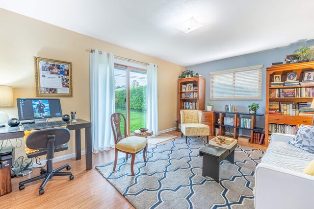 office featuring baseboards and wood finished floors