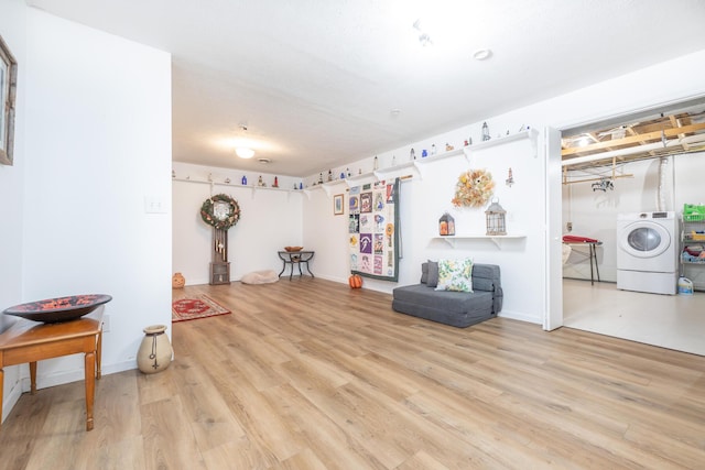 8339 Hite Rd, West Liberty, OH 43357 - sitting room with washer / clothes dryer, wood finished floors, and baseboards