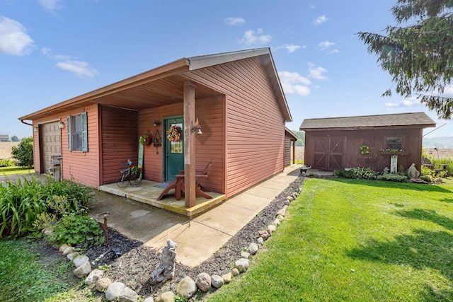 8339 Hite Rd, West Liberty, OH 43357 - view of front of property with a front yard and a garage