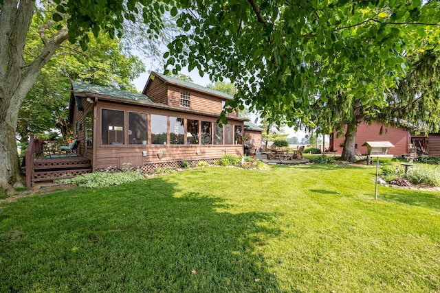 8339 Hite Rd, West Liberty, OH 43357 - view of green lawn featuring a sunroom and a wooden deck