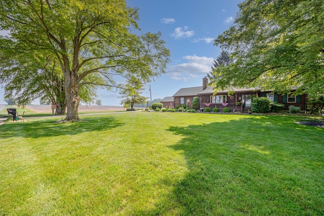 8339 Hite Rd, West Liberty, OH 43357 - view of green lawn featuring covered porch