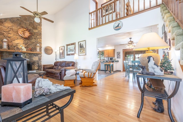8339 Hite Rd, West Liberty, OH 43357 - living area with a ceiling fan, high vaulted ceiling, light wood-type flooring, and a fireplace