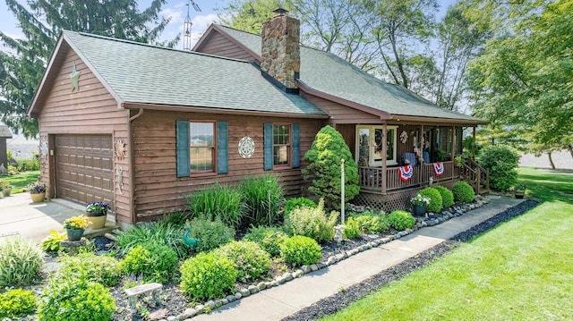 8339 Hite Rd, West Liberty, OH 43357 - view of front of property featuring a shingled roof, a chimney, covered porch, and a front yard