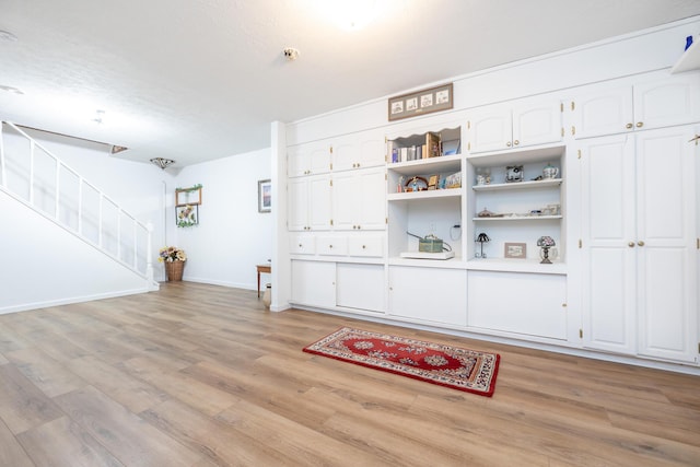 8339 Hite Rd, West Liberty, OH 43357 - interior space with light wood finished floors, baseboards, and stairs