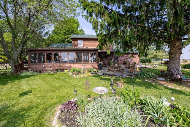8339 Hite Rd, West Liberty, OH 43357 - back of house featuring a sunroom, a patio area, and a yard