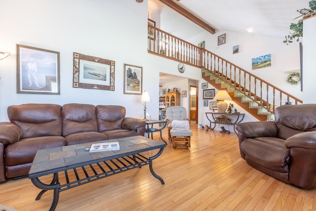 8339 Hite Rd, West Liberty, OH 43357 - living area with hardwood / wood-style floors, beamed ceiling, stairs, and high vaulted ceiling