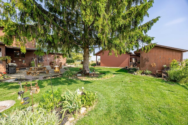 8339 Hite Rd, West Liberty, OH 43357 - view of green lawn featuring a patio