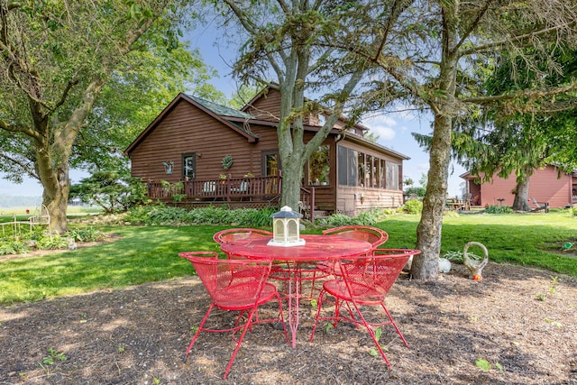 8339 Hite Rd, West Liberty, OH 43357 - back of house with a deck, a yard, and outdoor dining area