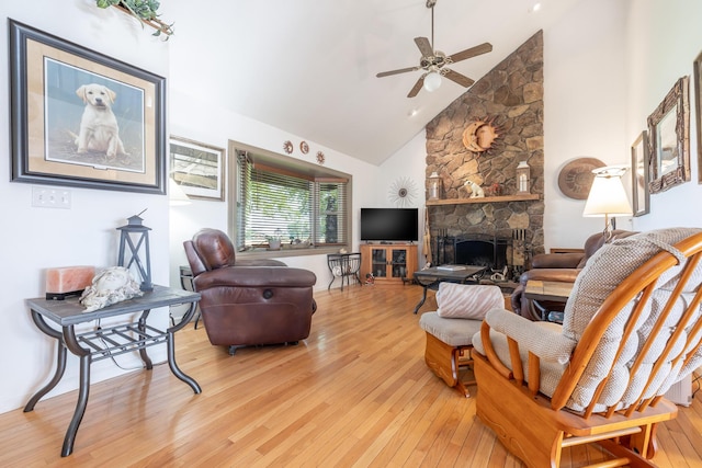 8339 Hite Rd, West Liberty, OH 43357 - living room featuring wood-type flooring, high vaulted ceiling, a ceiling fan, and a fireplace