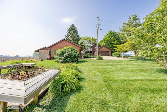 8339 Hite Rd, West Liberty, OH 43357 - view of grassy yard with a detached garage and an outdoor structure