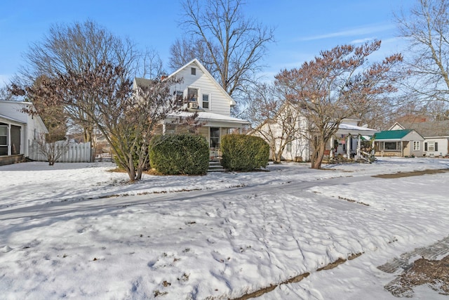 view of snow covered exterior with covered porch