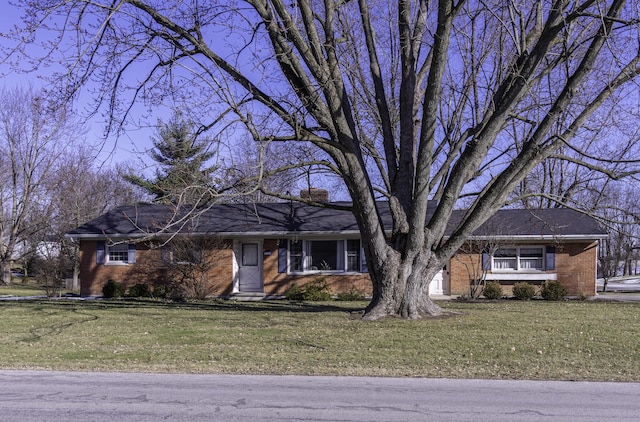 ranch-style home with a front yard