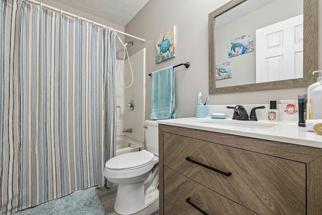 2909 W Barnhill Pl, Xenia, OH 45385 - full bath with a textured ceiling, toilet, shower / bathtub combination with curtain, and vanity