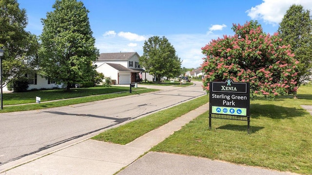 2909 W Barnhill Pl, Xenia, OH 45385 - view of asphalt street with sidewalks, curbs, and a residential view
