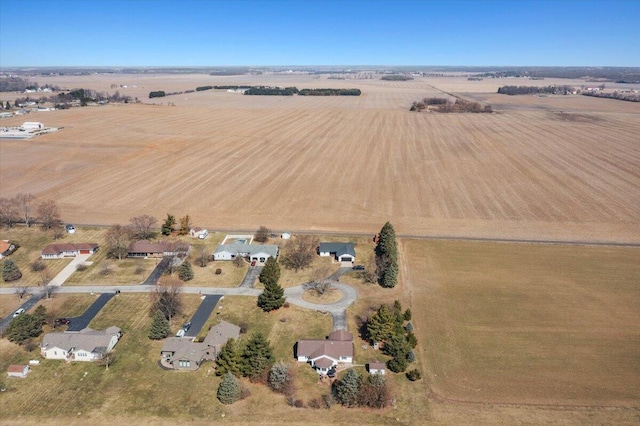 birds eye view of property with a rural view