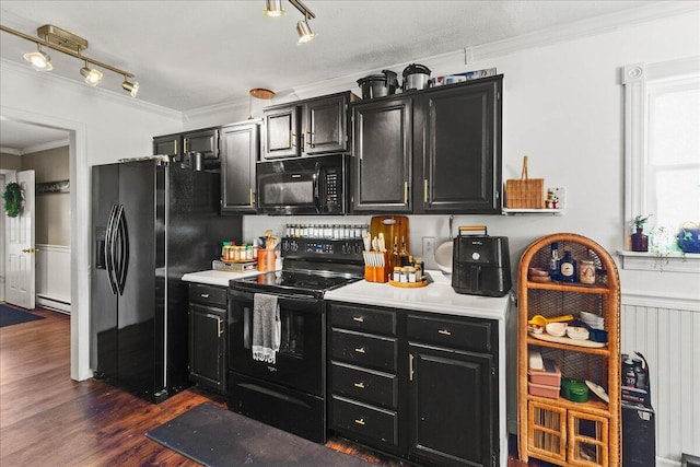 kitchen with a baseboard radiator, black appliances, light countertops, and dark cabinets