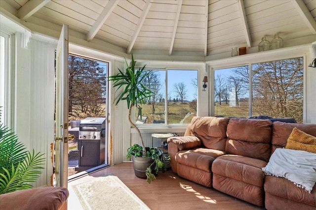 sunroom with lofted ceiling with beams